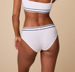 Back view of Ally wearing the Cloud Cotton Retro Hiphugger in White, highlighting the full-coverage back with a smooth, stretch cotton fabric.