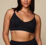 Woman wearing the Cloud Cotton Triangle Bralette in the color Black sizing: Alexandra wears size Large