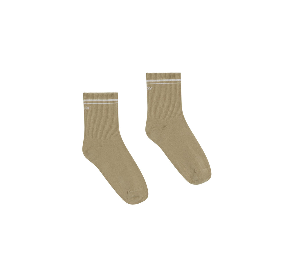 Flatlay of the Stay Wilde Quarter Crew Socks in Tarragon