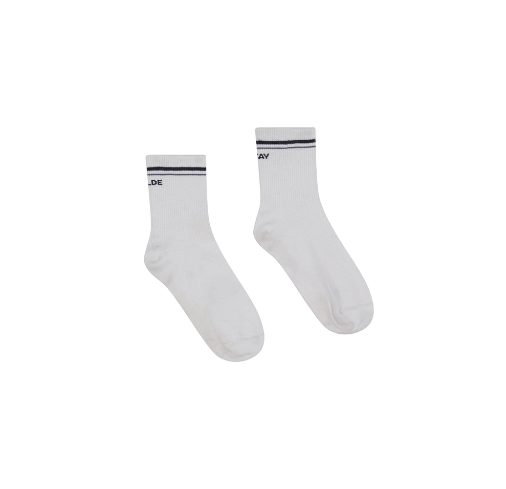 Flatlay of the Stay Wilde Quarter Crew Socks in White