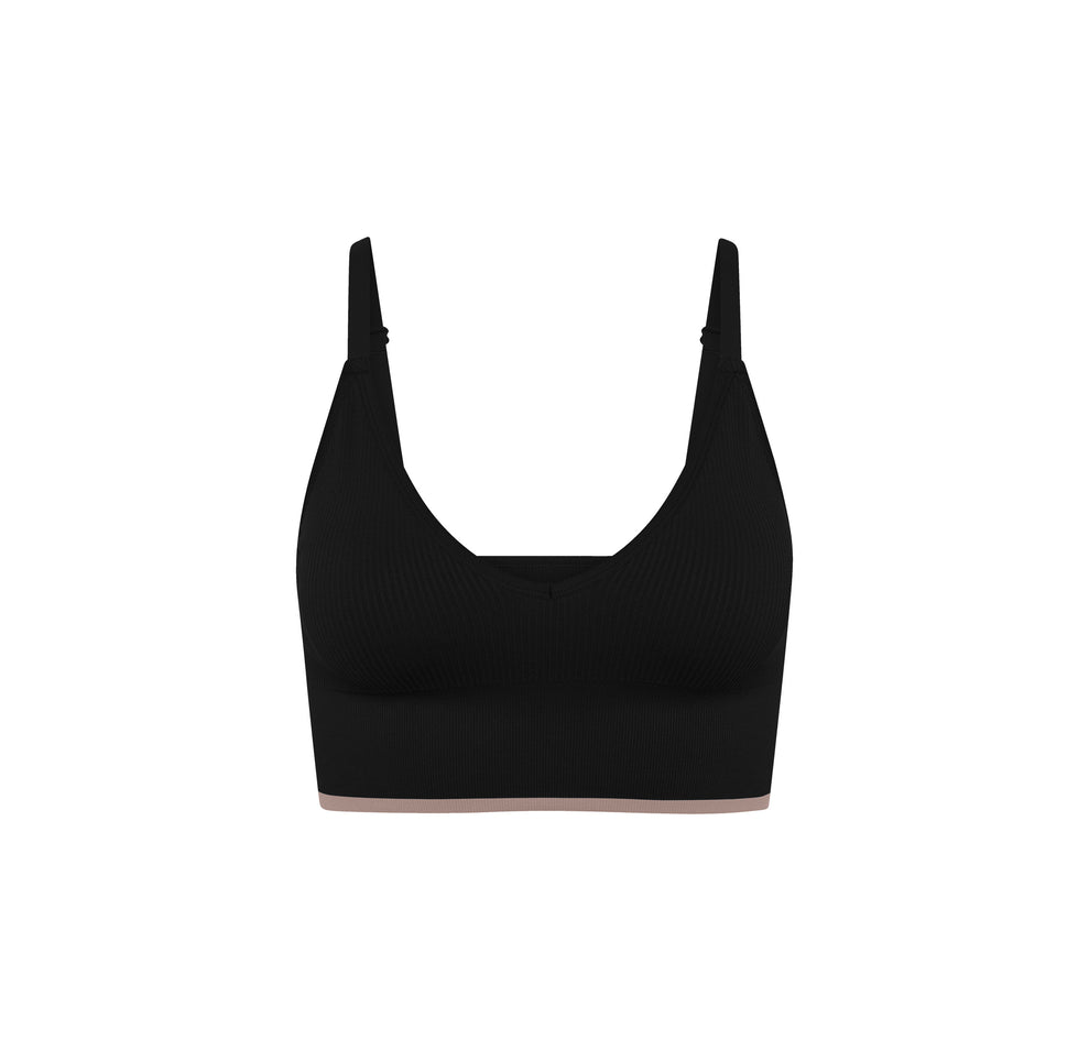 Flatlay of the Lounge Rib Triangle Bralette in Black