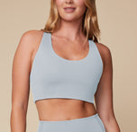 Megan standing confidently in the Flex Convertible Sports Bra and Flex High Rise Legging in Thistle, highlighting the front fit. sizing: Megan wears size Medium