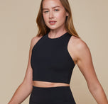 Erin wearing the Flex Racerback Tank showing the high neckline for a supportive, but comfortable fit.