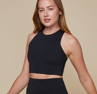 Erin wearing the Flex Racerback Tank showing the high neckline for a supportive, but comfortable fit.