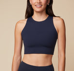 Anna wearing the Flex Racerback Sport Tank in Ink. The tank features a high neckline and cropped fit. sizing: Anna wears size Small