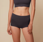Anna wearing the Lounge Rib Boyshort in Charcoal. The ribbed fabric and stretchy waistband are emphasized. sizing: Anna wears size Small