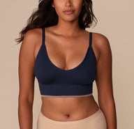 ront View
Victoria wearing the Lounge Rib Triangle Bralette in True Blue, shown from the front. The deep V neckline and thin adjustable straps enhance the natural shape, while the ribbed fabric adds texture and softness. The contrast taupe band at the bottom provides a subtle yet stylish finish. sizing: Victoria wears size Medium