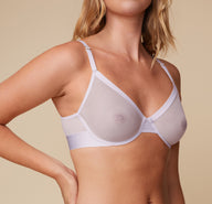 Close-up front view of Megan wearing the Luxe Plunge Bralette in Opal, focusing on the plunge neckline and soft, supportive mesh cups.