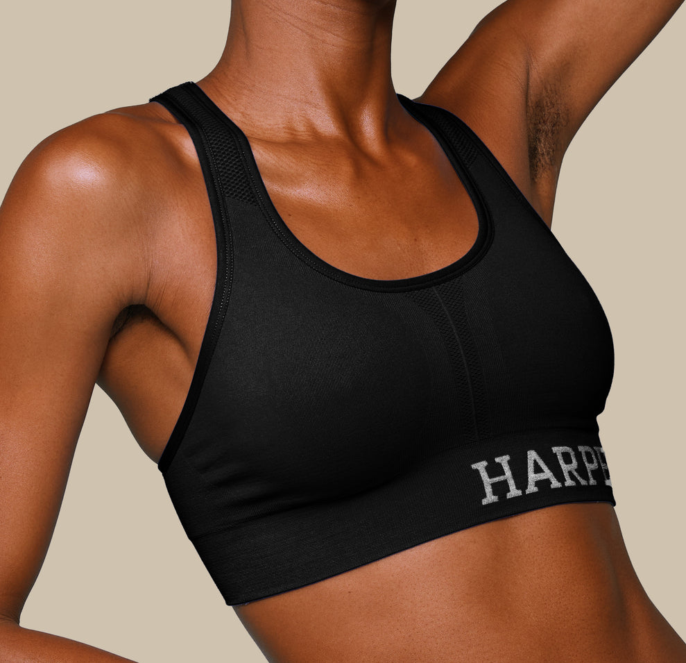 Woman wearing the Move Sports Bra in the color Black