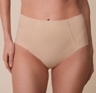 A close-up of the No-Show Highwaist Brief in Beige, showcasing the raw-edge finish and soft, stretchy fabric.