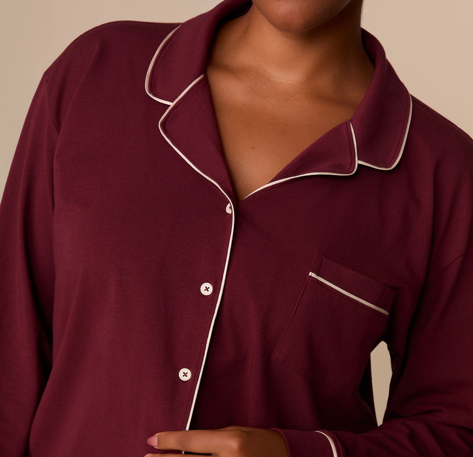 Close-up of the Perfect Pima Long Sleeve Pajama Shirt in Bordeaux, focusing on the white piping along the collar and chest pocket.