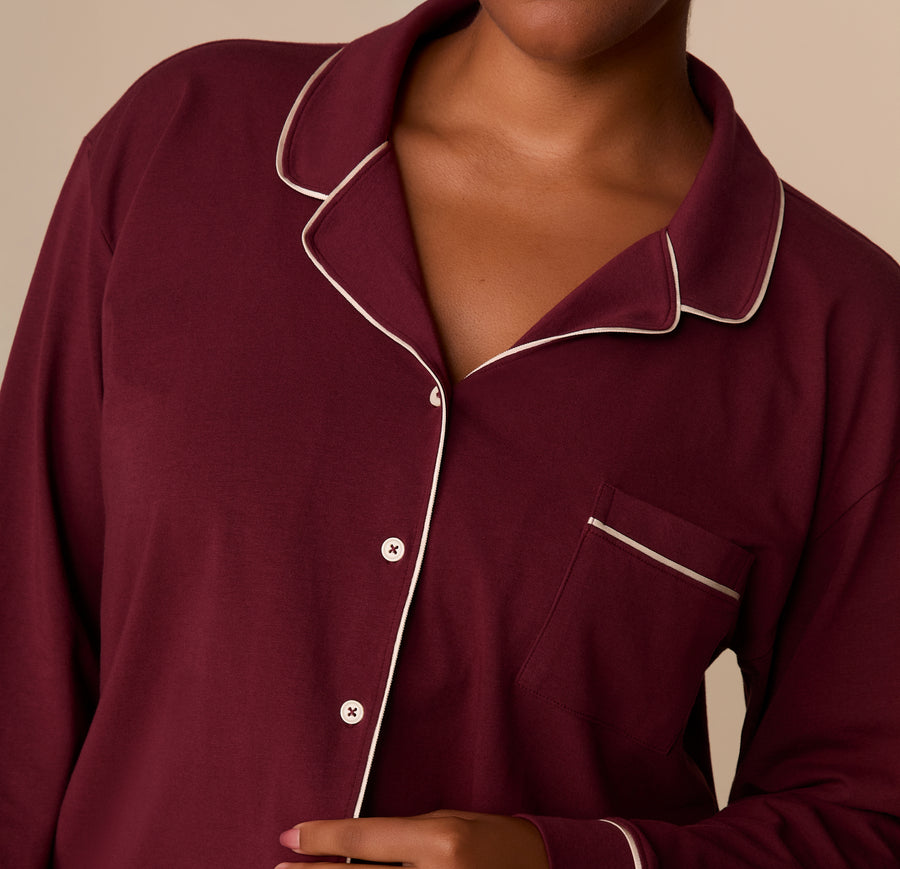 Close-up of the Perfect Pima Long Sleeve Pajama Shirt in Bordeaux, focusing on the white piping along the collar and chest pocket.