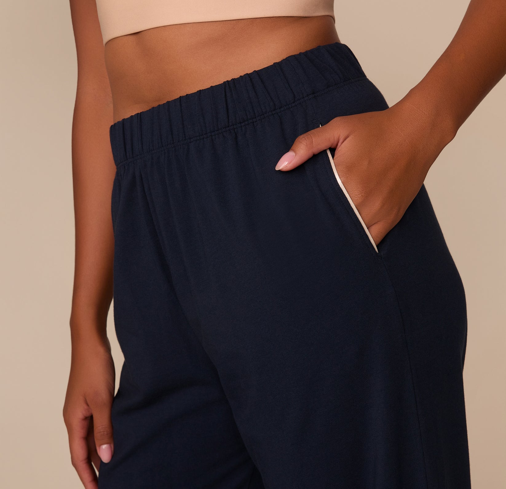 Close-up of the Perfect Pima Pajama Pants' side pocket area, highlighting the ivory contrast piping detail and soft texture of the Pima cotton fabric.