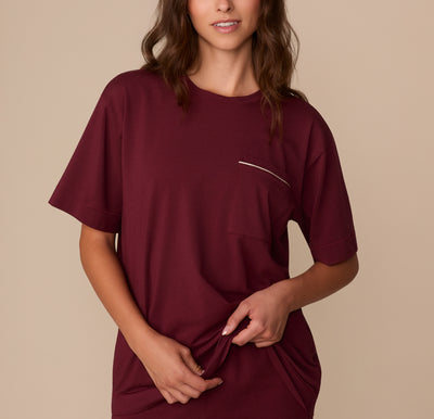 Front view of model Alexis wearing the Perfect Pima Pajama Tee in Bordeaux. The tee features a relaxed fit with a chest pocket trimmed in white piping. sizing: Alexis wears size Small