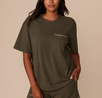 Front view of model Victoria wearing the Perfect Pima Pajama Tee and Shorts in Olive. The short-sleeve tee features a relaxed fit and a chest pocket trimmed with white piping. sizing: Victoria wears size Medium