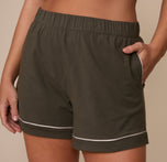 Close-up of the Perfect Pima Pajama Shorts in Olive focusing on the soft waistband and white trim on the pockets and hem.
