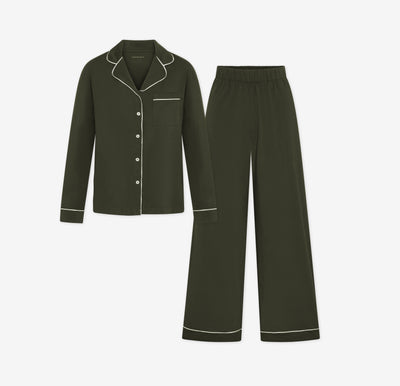 Harper Wilde Pima Pajama Set in Olive. Includes long sleeve, button-up top with white piping and matching long pajama pants. Set laid flat on a white background.