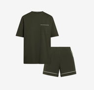 Harper Wilde Pima Pajama Set in Olive. Includes relaxed fit tee with white chest pocket piping and matching pajama shorts. Set laid flat on a white background.