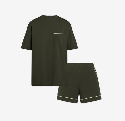 Harper Wilde Pima Pajama Set in Olive. Includes relaxed fit tee with white chest pocket piping and matching pajama shorts. Set laid flat on a white background.