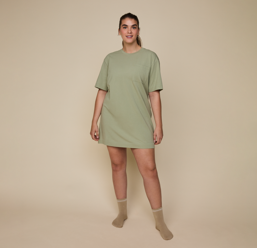 Model wearing the Quarter Crew Socks in the color Tarragon.