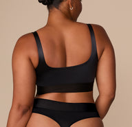 Back view of Zarria in the Stretch Satin Square Neck Bralette, showing the full-coverage back and supportive band.