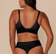 Back view of Victoria in the Stretch Satin Triangle Bralette in Black, highlighting the adjustable straps and hook-and-eye closure along the wide band.
