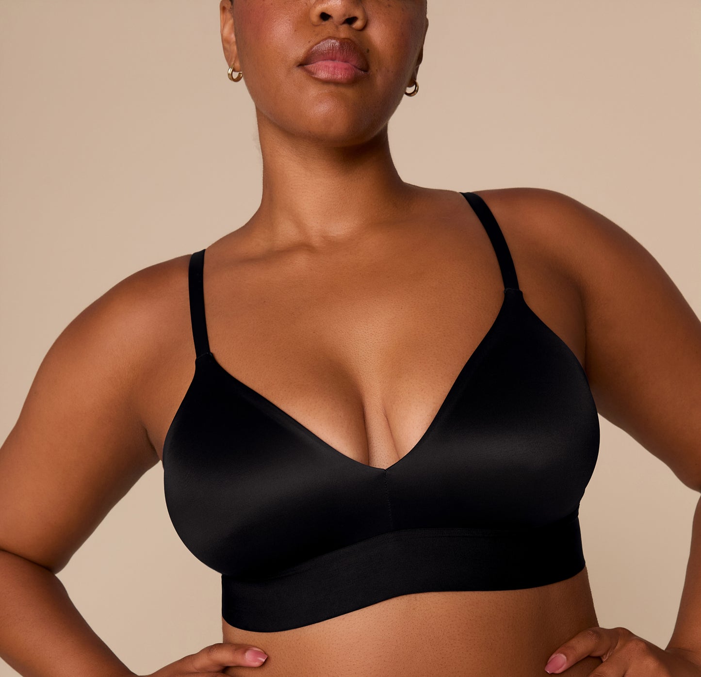 Zarria wearing the Stretch Satin Triangle Bralette in Black, paired with the matching Highwaist Thong. sizing: Zarria wears size XL