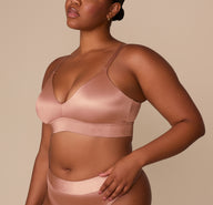 Zarria wearing the Stretch Satin Triangle Bralette in Champagne, paired with the matching Highwaist Thong. sizing: Zarria wears size XL