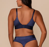 Back view showing adjustable straps and hook-and-eye closure on the Stretch Satin Triangle Bralette in Navy.