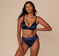 Full front view of Victoria modeling the Stretch Satin Triangle Bralette in Navy with matching Highwaist Thong.
