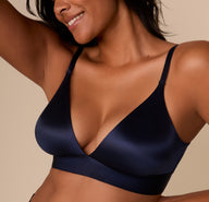Close-up of the Navy Triangle Bralette’s smooth satin finish and plunging neckline.