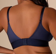 Back close-up of the bralette’s band and strap detailing in Navy. The adjustable straps and hook and eye back are emphasized.
