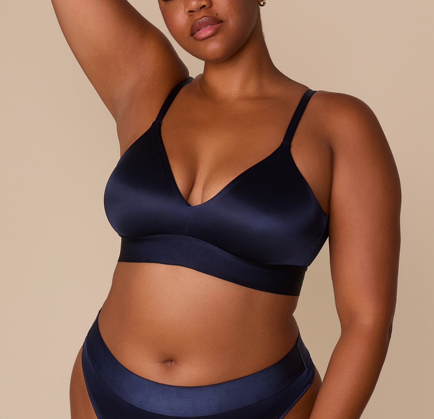 Zarria wearing the Stretch Satin Triangle Bralette in Navy, paired with the matching Highwaist Thong, showcasing a curve-inclusive fit. sizing: Zarria wears size XL
