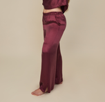 Model wearing the Silky Sleep Pant in the color Sangria. sizing: Summerlyn is 5'11" and wears size Large