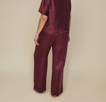 Model wearing the Silky Sleep Pant in the color Sangria.