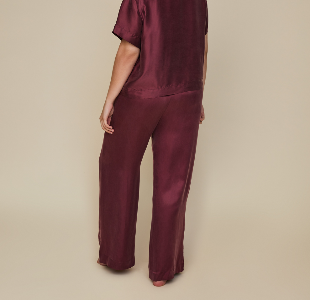 Model wearing the Silky Sleep Pant in the color Sangria.