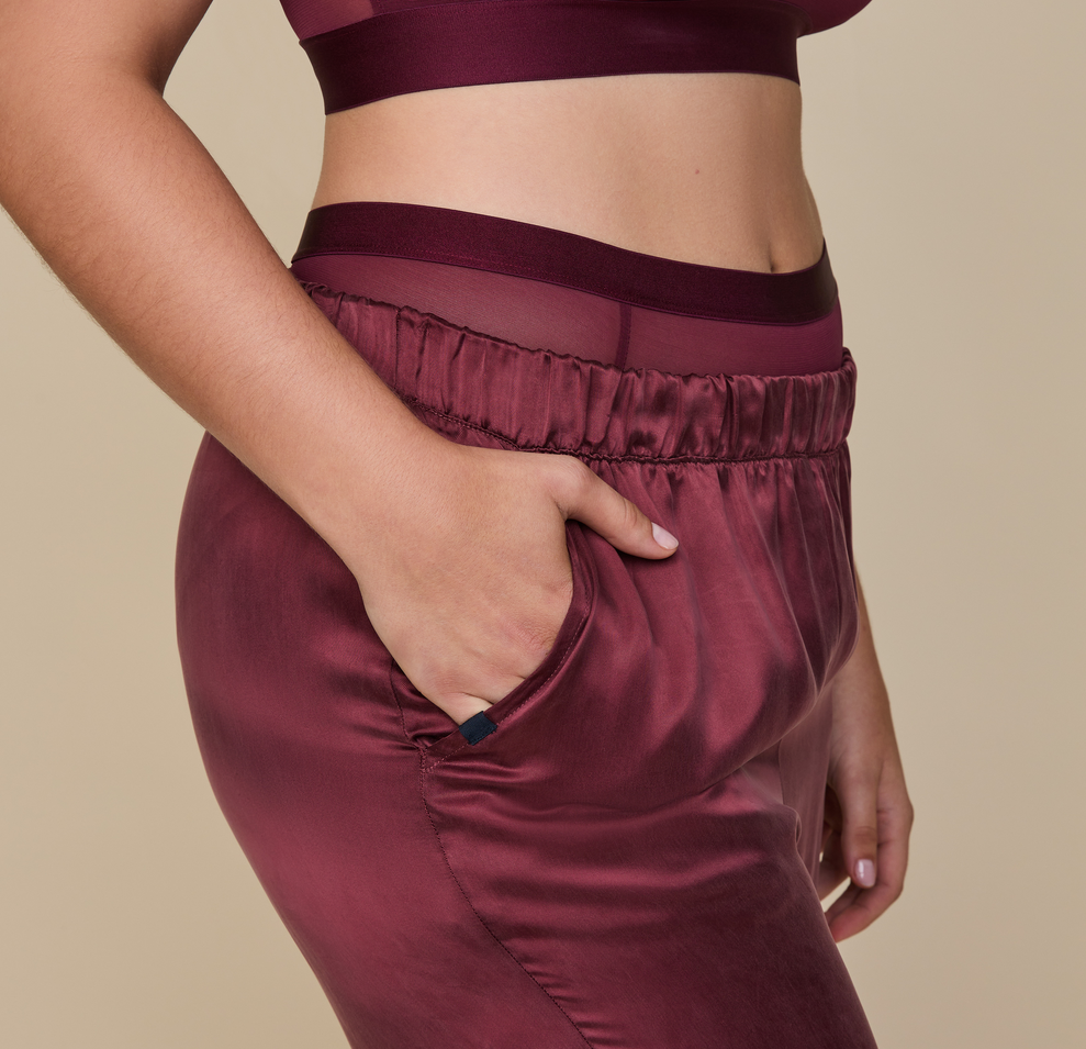 Model wearing the Silky Sleep Pant in the color Sangria.