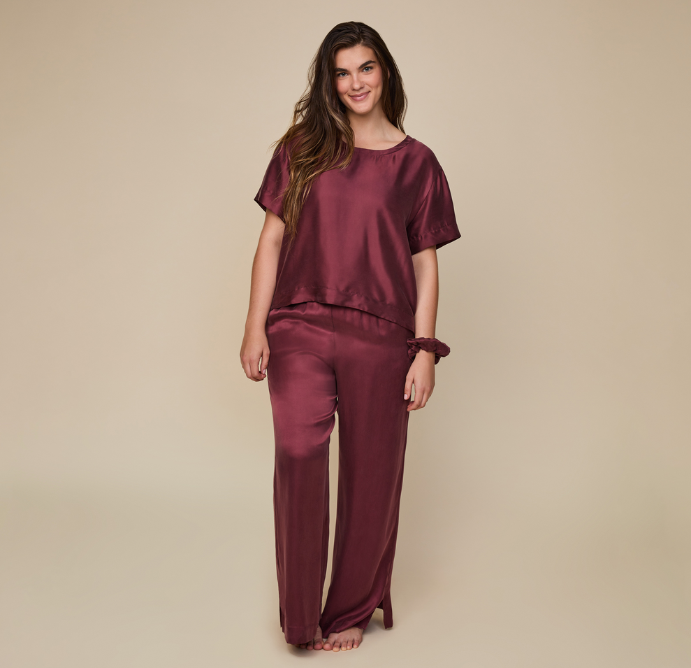 Model wearing the Silky Sleep T-Shirt in the color Sangria. sizing: Summerlyn wears size Large