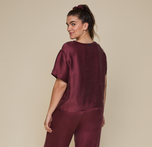 Model wearing the Silky Sleep T-Shirt in the color Sangria.
