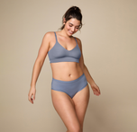 Woman wearing the Bliss Triangle Bralette in the color Steel. sizing: Kate wears size Large. Sizes L-6XL have higher center in front for additional support.