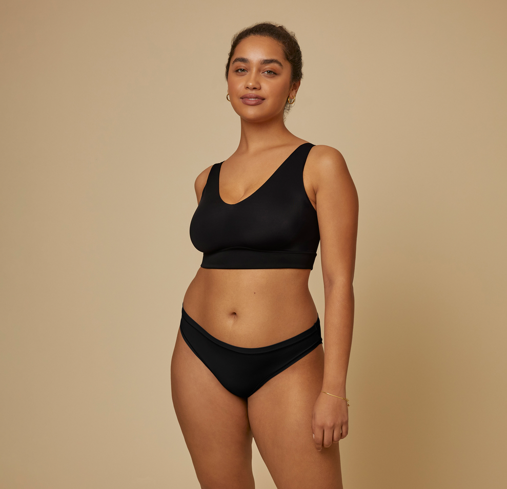 Woman modeling the bliss bikini underwear in black