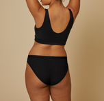 Woman modeling the bliss bikini underwear in black