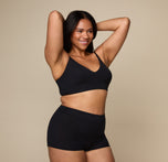 Woman wearing the Cloud Cotton Triangle Bralette in the color Black