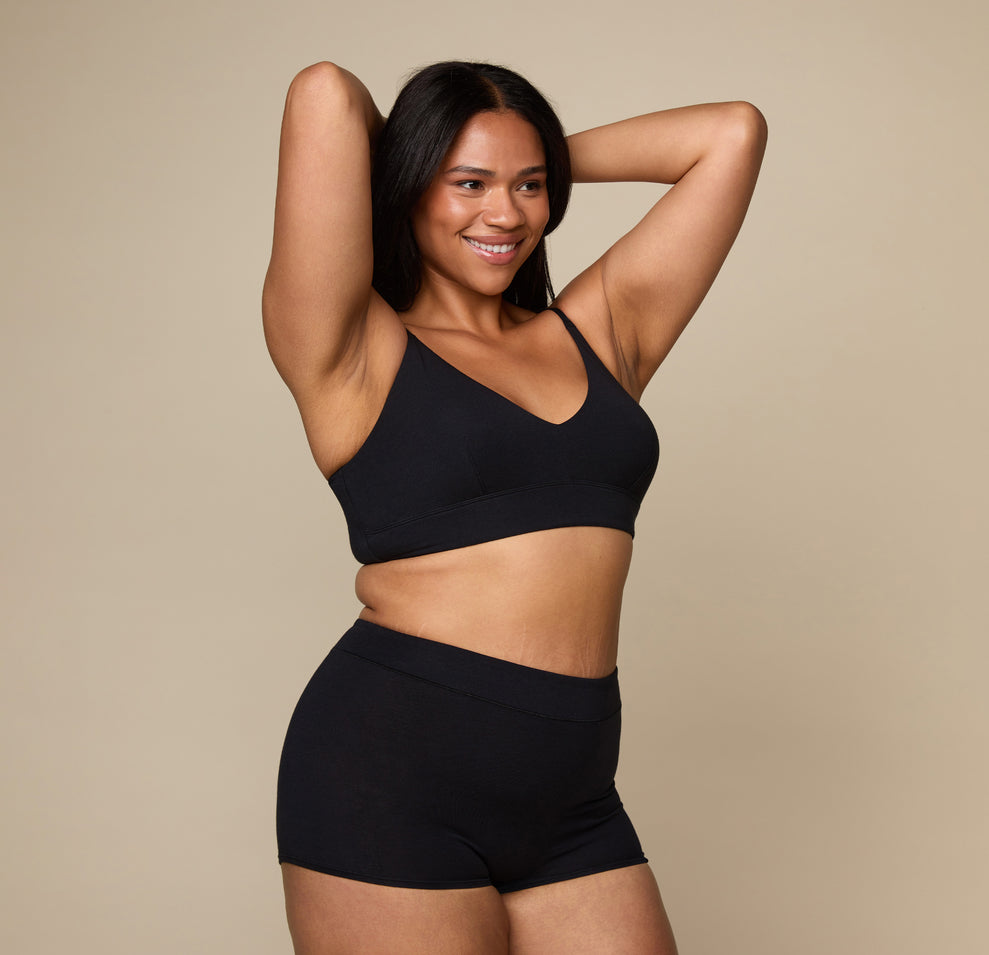 Woman wearing the Cloud Cotton Triangle Bralette in the color Black