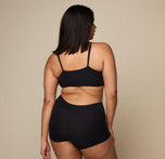 Woman wearing the Cloud Cotton Triangle Bralette in the color Black