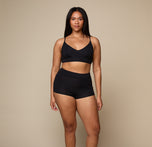Woman wearing the Cloud Cotton Triangle Bralette in the color Black