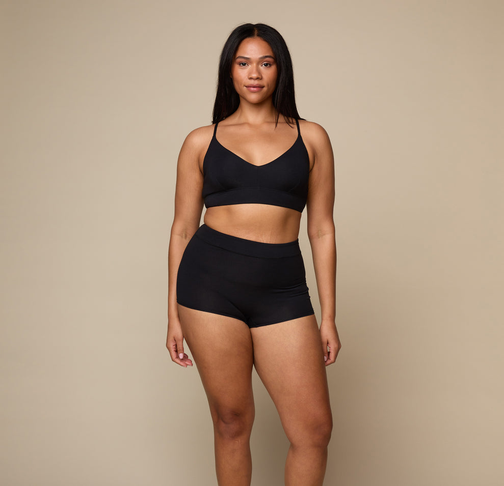 Woman wearing the Cloud Cotton Triangle Bralette in the color Black